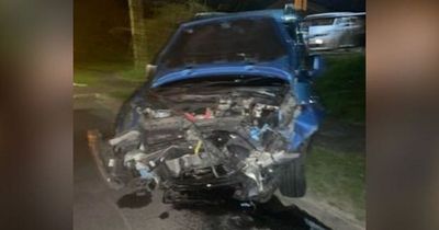 Baby girl and boy, 6, rushed to hospital after BMW smashes into parked car