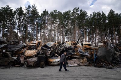 AP PHOTOS on Day 47: Exhumed bodies on outskirts of Kyiv