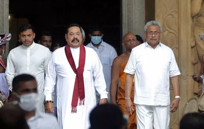 Sri Lanka leaders defiant at home while scrambling for funds
