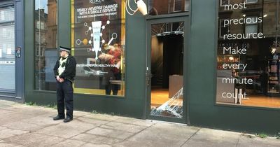 Upmarket Glasgow hair salon raided in early hours leaving door caved in