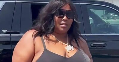 Lizzo keeps cool on flight with thong shapewear as she teases 'song of the summer'