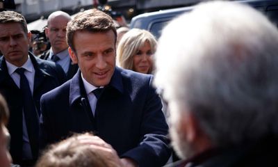 France election: voting under way with Macron and Le Pen vying closely for presidency