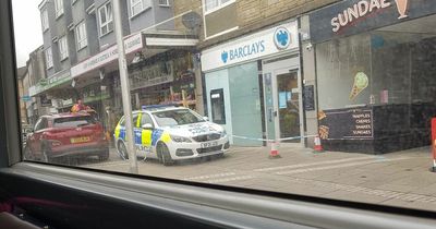 Police cordon off bank outside Glasgow after report of vandalism