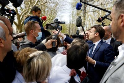 Macron defends pensions shift as French campaign brawl heats up