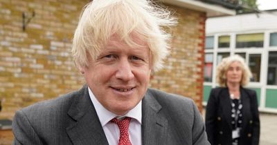 Boris Johnson fined by police over birthday party where he was 'ambushed by cake'