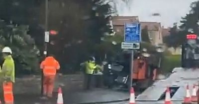 Edinburgh man rushed to hospital after roller pictured 'on its side' on busy road