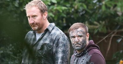 Tyrone plays dirty in ITV Corrie drama as mechanic and love rival Phill fight in wet cement
