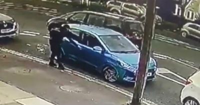 Thief steals woman's car and reverses it over her in 'sickening' footage