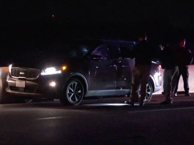 911 call about stalled car leads police to dying woman inside SUV riddled with bullets