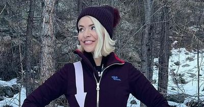 Holly Willoughby shows off her incredible figure as she braves the cold in a jumpsuit