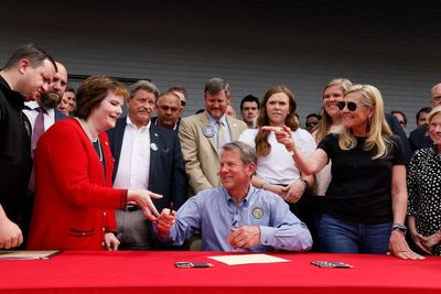 Georgia Gov. Kemp signs bill easing gun laws amid primary