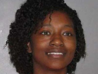 Woman accused of hitting school security official with car and evading police is arrested