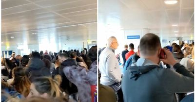 Footage shows Manchester Airport passengers sandwiched into terminal as man says he's 'never seen anything like it'