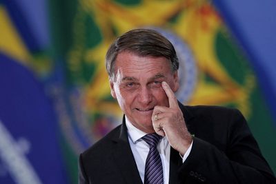 Brazil poll shows Bolsonaro halving Lula lead in a month