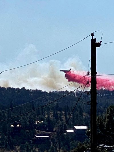 Wind whips destructive wildfires in New Mexico, Colorado
