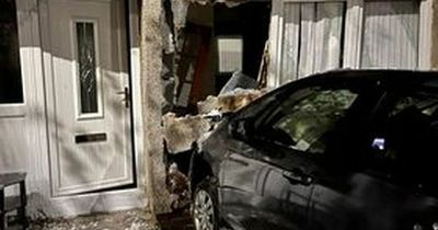 Scottish mum left screaming after a car crashes through her living room wall