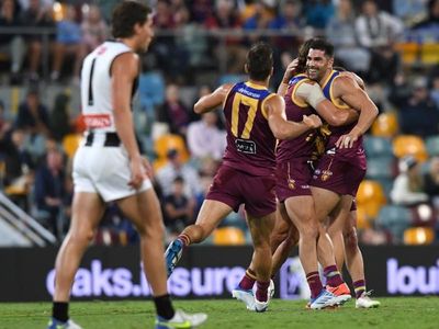 Lions withstand Magpies late for AFL win
