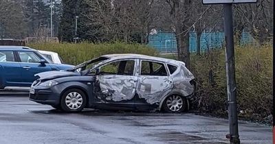 Midlothian locals woken by loud 'explosion' as burnt out motor pictured in car park