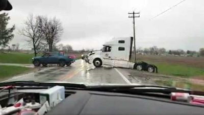 Rivian R1T Effortlessly Pulls Stuck Semi Truck Free