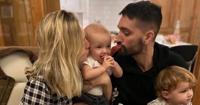 Tom Parker's wife says 'daddy came to see us' as daughter, 2, holds white feather