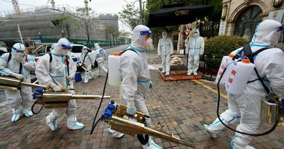 Chinese cops in hazmat suits seize people's HOMES in world's strictest Covid lockdown