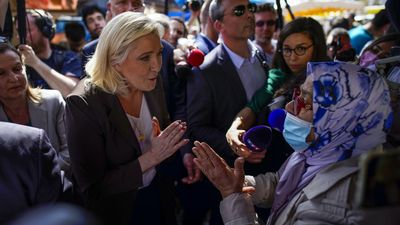 Headscarves enter French election fray as Muslim women confront Le Pen, Macron