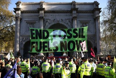 Six arrested as climate activists scale Marble Arch and oil tanker