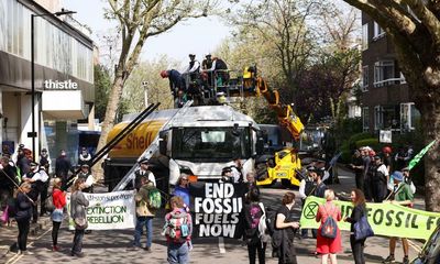 Six arrested after climate activists scale oil tanker in central London