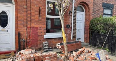 Woman devastated after two cars smash into the front of her house