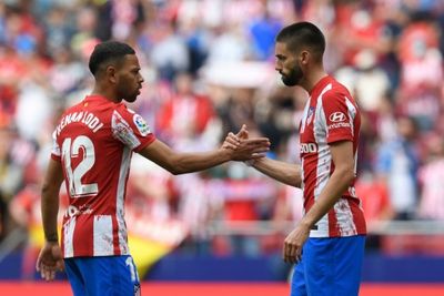 Carrasco scores late penalty to see 10-man Atletico past Espanyol