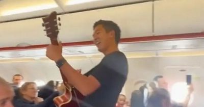 Man playing guitar takes over flight mid-air to sing Christian gospel songs at 30,000ft