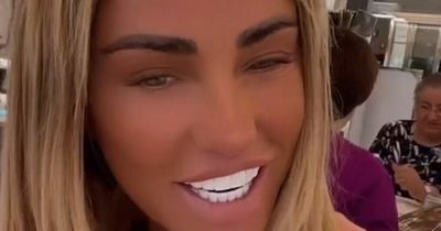 Katie Price sups cocktail on sun-soaked holiday after jetting off with 'ex' Carl Woods