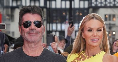 Amanda Holden stuns in silver swimsuit as she holidays with BGT boss Simon Cowell