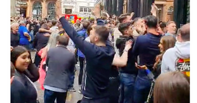 Rangers fans’ pavement pandemonium captured on film as pub fire alarm sees them watch winner through window