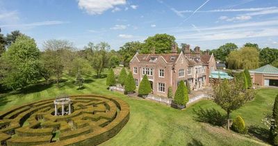 Billionaire divorce mansion with hedge maze and helipad on sale in Surrey for £32m