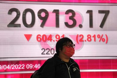 Asian shares mostly gain as China boosts support for economy