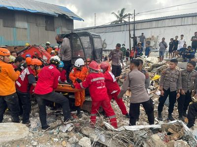 Indonesia rescuers search rubble after mini-market collapse kills 5