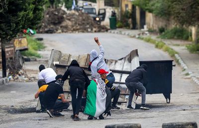 Palestinians injured after Israeli settlers march to outpost