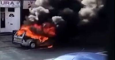 Car fire covers Leeds shopping street in black smog as blaze completely destroys vehicle