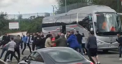 Football fans clash in footage of violent brawl as punches thrown and 'blood everywhere'