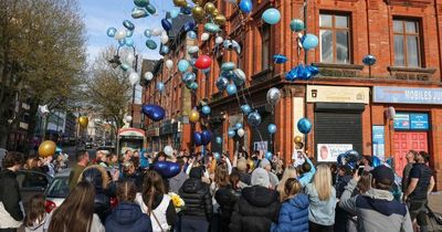 Emotional moment loved ones release hundreds of balloons in memory of Michael Toohey