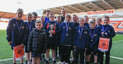 Blackpool FC striker Shayne Lavery surprises Belfast football kids after match