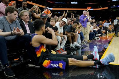 Devin Booker fist bumping a baby is one of the most adorable moments in playoff history