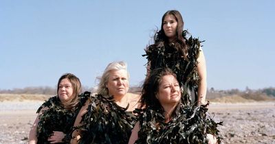 The people posing dressed in seaweed for a very good reason