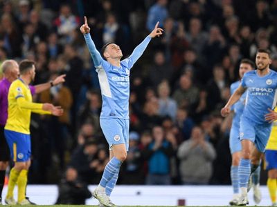 Man City break down stubborn Brighton to maintain title charge