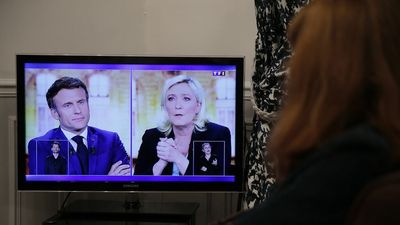 Macron hits Le Pen on Putin ties and headscarf ban in tense debate