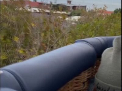 Hot air balloon crash lands on Melbourne apartment rooftop, no one injured