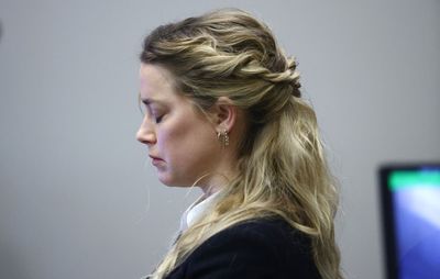 Amber Heard fights back tears as court is shown video of Johnny Depp ‘assaulting cabinets’