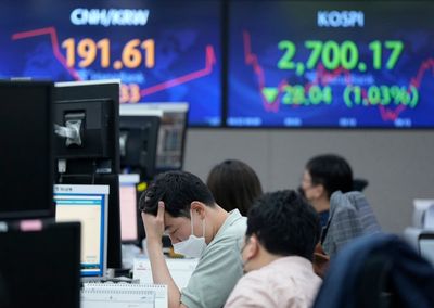 Asian shares decline after Fed chief's comments on inflation