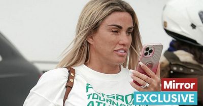 Katie Price flashes engagement ring as she returns from holiday with 'ex' Carl Woods